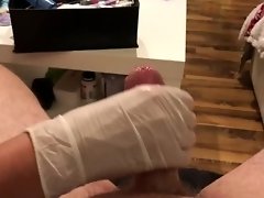 Wife gives sloppy handjob orgasm in doctor gloves video on WebcamWhoring.com